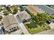 Aerial view of cozy home featuring a well-maintained yard, quaint design, and private driveway at 13325 1St E St, Madeira Beach, FL 33708