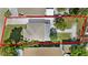 Aerial view of the property lines showing the house, outbuildings, and the yard at 13325 1St E St, Madeira Beach, FL 33708