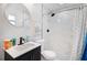 Bright bathroom featuring a modern vanity and a shower with marble-look tile at 13325 1St E St, Madeira Beach, FL 33708