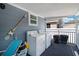 Covered laundry area on the porch with a washer and dryer at 13325 1St E St, Madeira Beach, FL 33708