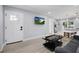 Inviting living room with modern flooring, a comfortable sofa, and an open layout perfect for entertaining at 13325 1St E St, Madeira Beach, FL 33708