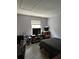 Bedroom with a window and various pieces of furniture at 13709 Juniper Blossom Dr, Tampa, FL 33618