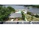 Aerial view showcasing the pool, clubhouse, landscaping and parking of the community at 13755 Orange Sunset Dr # 101, Tampa, FL 33618