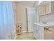 Bright bathroom featuring vanity with storage, sink, mirror and tile flooring at 13755 Orange Sunset Dr # 101, Tampa, FL 33618