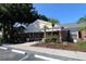 Community clubhouse with ample parking and landscaping at 13755 Orange Sunset Dr # 101, Tampa, FL 33618