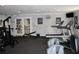 Community gym featuring treadmills, elliptical machines, and weight training equipment at 13755 Orange Sunset Dr # 101, Tampa, FL 33618