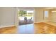 Bright room with wood floors and sliding doors that open up to a screened patio overlooking a pond at 13755 Orange Sunset Dr # 101, Tampa, FL 33618