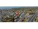 Captured aerial showing properties near commercial zones, waterways, and a coastal community lifestyle at 13800 Judy Ave, Hudson, FL 34667