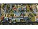 Aerial view showcasing waterfront homes with lush landscaping and boat docks along a peaceful canal at 13800 Judy Ave, Hudson, FL 34667