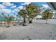 Spacious backyard featuring patio furniture, grill, and well-maintained gravel landscaping at 13800 Judy Ave, Hudson, FL 34667