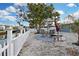 Backyard patio area features comfortable seating and an outdoor grill near the waterfront at 13800 Judy Ave, Hudson, FL 34667