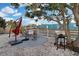 Outdoor patio area with a grill, table, and umbrella perfect for outdoor dining and relaxation at 13800 Judy Ave, Hudson, FL 34667
