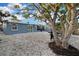 Beautifully landscaped backyard with outdoor grill, patio, and plenty of space for activities at 13800 Judy Ave, Hudson, FL 34667
