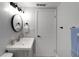 Clean bathroom featuring a modern vanity, round mirror, and stylish black fixtures at 13800 Judy Ave, Hudson, FL 34667
