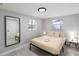Inviting bedroom with large mirror, comfortable bedding, and natural light at 13800 Judy Ave, Hudson, FL 34667