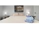 Serene bedroom featuring soft lighting, calming artwork, and plush bedding at 13800 Judy Ave, Hudson, FL 34667