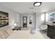 A light-filled bedroom with a large mirror and calming decor for a relaxing ambiance at 13800 Judy Ave, Hudson, FL 34667