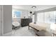 This bedroom features bright natural light, tile floors, and stylish furnishings at 13800 Judy Ave, Hudson, FL 34667