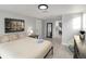 A beautifully staged bedroom featuring tile floors, a large mirror, and neutral color scheme at 13800 Judy Ave, Hudson, FL 34667