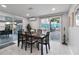 Dining room boasts sliding glass doors and neutral decor with an outdoor view at 13800 Judy Ave, Hudson, FL 34667