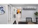 Bright hallway with a view to the living room and an orange door at 13800 Judy Ave, Hudson, FL 34667