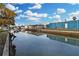 Waterfront view with boats docked and reflective waters, offering serene and picturesque scenery at 13800 Judy Ave, Hudson, FL 34667