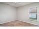 Cozy bedroom features carpeted floors, a ceiling fan, and a window providing natural light at 14266 Creek Run Dr, Riverview, FL 33579