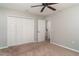 Bright bedroom features a ceiling fan, closet, and easy access to an ensuite bathroom at 14266 Creek Run Dr, Riverview, FL 33579