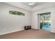 Spacious primary bedroom with ceiling fan, and sliding glass door to screened pool at 14266 Creek Run Dr, Riverview, FL 33579