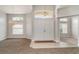 Bright foyer with double-door entry, chandelier, tile flooring, and neutral paint at 14266 Creek Run Dr, Riverview, FL 33579