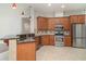 Modern kitchen featuring stainless steel appliances and granite countertops at 14266 Creek Run Dr, Riverview, FL 33579