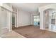 Open-concept living room with neutral walls, tile flooring, and patio access at 14266 Creek Run Dr, Riverview, FL 33579
