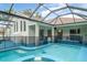 The screened-in pool area features a safety fence and exterior access to the home's living space at 14266 Creek Run Dr, Riverview, FL 33579