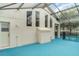 Enclosed pool area with screened ceiling, blue pool deck, and direct access to the home at 14266 Creek Run Dr, Riverview, FL 33579