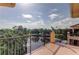 Balcony overlooking pond and lush landscaping at 1531 Ember Ln, Tarpon Springs, FL 34689