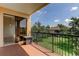 Cozy balcony offering an outdoor space with views of a well-maintained lawn at 1531 Ember Ln, Tarpon Springs, FL 34689