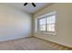 Bright bedroom with neutral walls and carpet, featuring a window with a sill at 1531 Ember Ln, Tarpon Springs, FL 34689