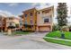 Beautiful three-story home featuring multiple balconies, manicured lawn, and a two-car garage at 1531 Ember Ln, Tarpon Springs, FL 34689