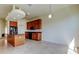Kitchen featuring custom cabinets, granite counters, tile floor and black appliances at 1531 Ember Ln, Tarpon Springs, FL 34689