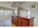 Open kitchen with a breakfast bar that connects the kitchen to the living room at 1531 Ember Ln, Tarpon Springs, FL 34689