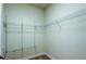 Empty walk-in closet with wire shelving ready for organization at 1531 Ember Ln, Tarpon Springs, FL 34689