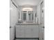 This pristine bathroom boasts dual mirrors, ample storage, and modern fixtures at 15713 Century Dr, Hudson, FL 34667