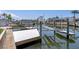 The property features a private dock with a modern boat lift system for easy access to the water at 15713 Century Dr, Hudson, FL 34667