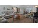 Cozy living room with wood floors, comfortable seating, and a view to the outdoors at 15713 Century Dr, Hudson, FL 34667