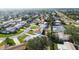 An aerial view shows the houses on a block with mature trees and well-manicured lawns at 1701 62Nd S Ter, St Petersburg, FL 33712