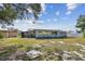 This exterior shows a single-story home with a screened patio and tidy landscaping at 1701 62Nd S Ter, St Petersburg, FL 33712