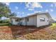 Rear view of the house displaying the structure and corner landscaping features at 1701 62Nd S Ter, St Petersburg, FL 33712