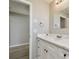 Bathroom vanity with white marble countertop, storage, and brushed-nickel fixtures at 1701 62Nd S Ter, St Petersburg, FL 33712