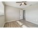 Bedroom with wood-look floors and a door leading to the bathroom at 1701 62Nd S Ter, St Petersburg, FL 33712