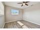 Bright bedroom featuring neutral paint, modern ceiling fan and light-colored wood-look floors at 1701 62Nd S Ter, St Petersburg, FL 33712